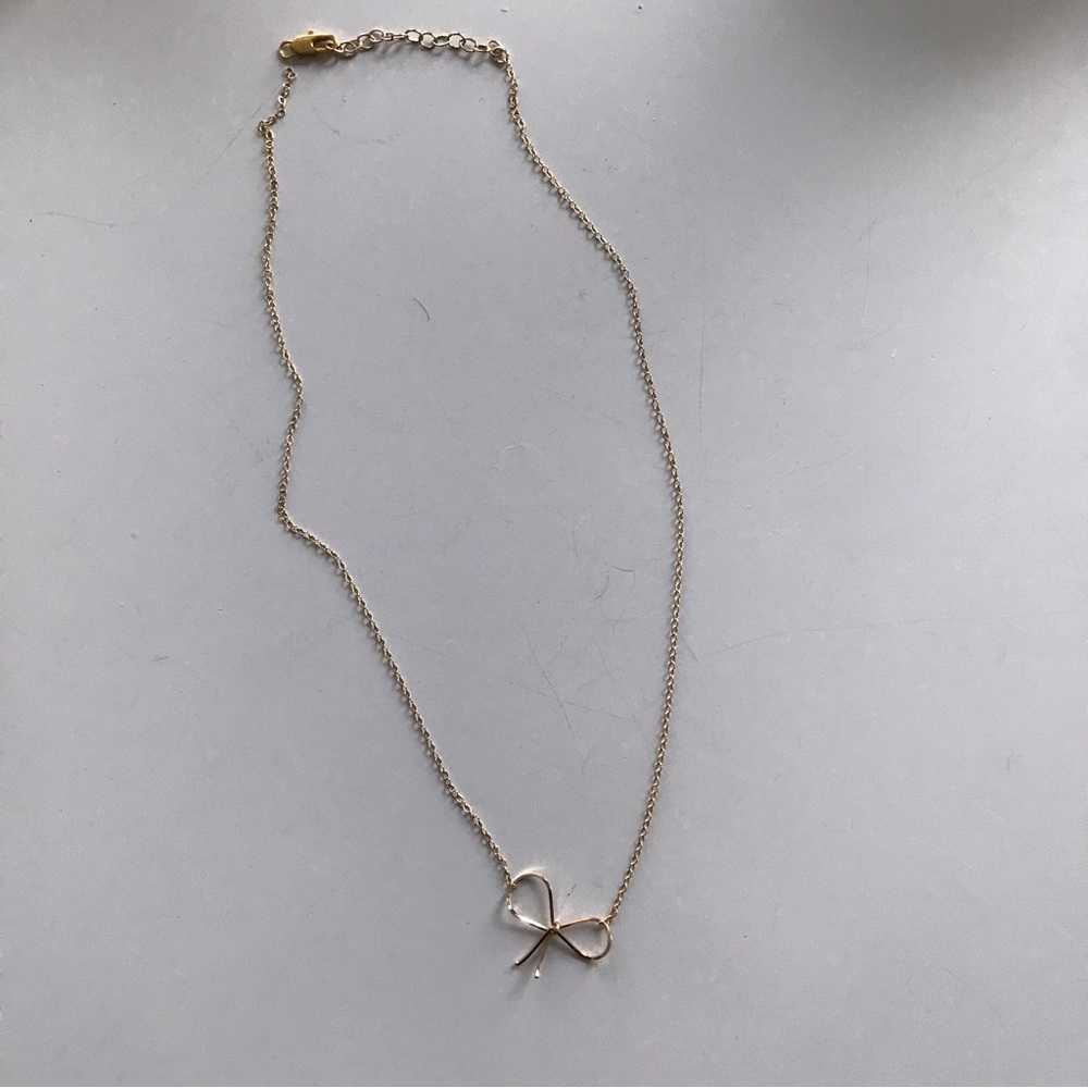 Anthropology gold bow necklace